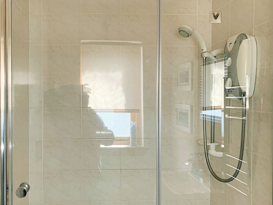 Shower room with shower cubicle and heated towel rail | Crossburn Hideaway, Arden, near Helensburgh