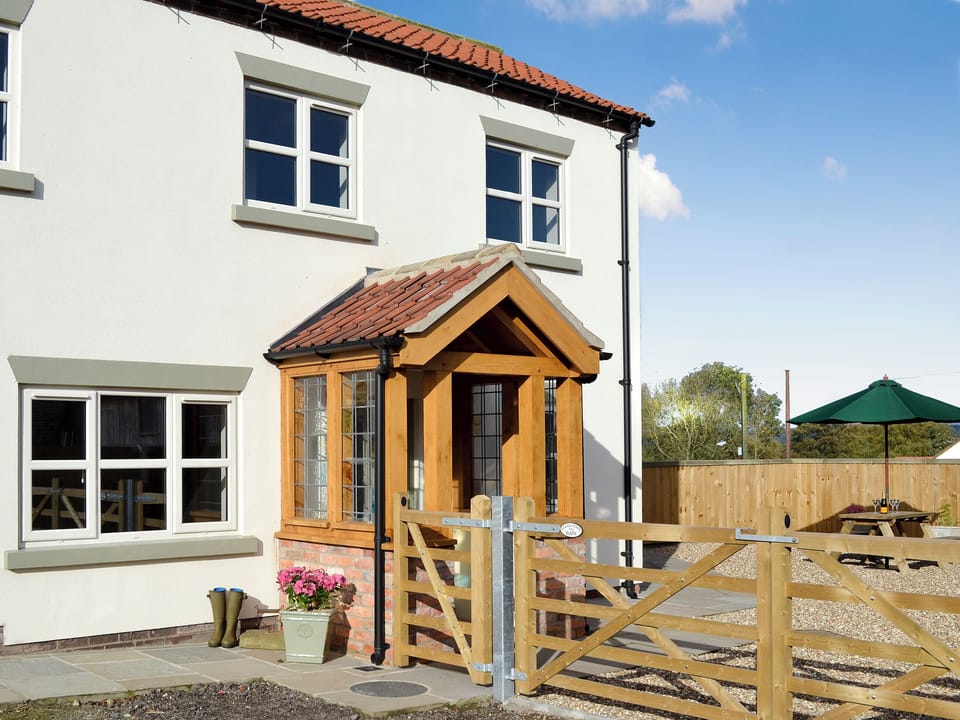 Semi-detached cottage are set around a traditional fold yard | Park Farm Cottage, Flixton, near Filey