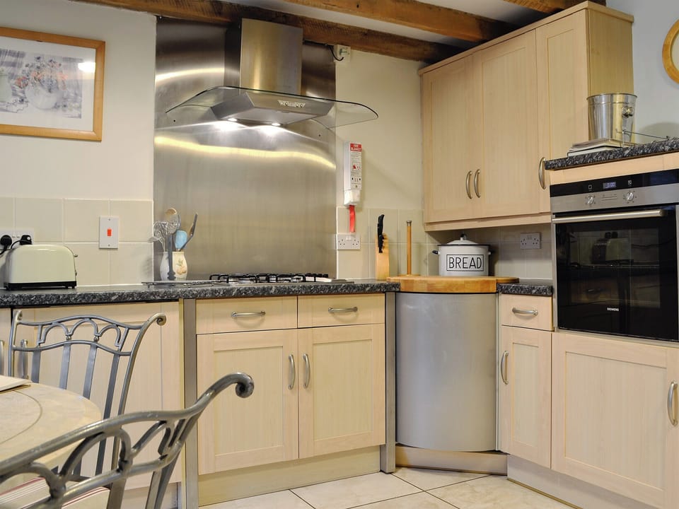 Well equipped kitchen area | The Granary - Crwys Farm, Three Crosses, Gower, Swansea
