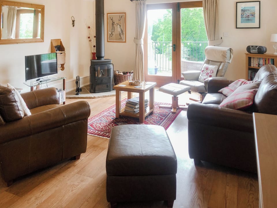 Living room with wood burner | Swallow&rsquo;s Barn, Ashburnham, Battle