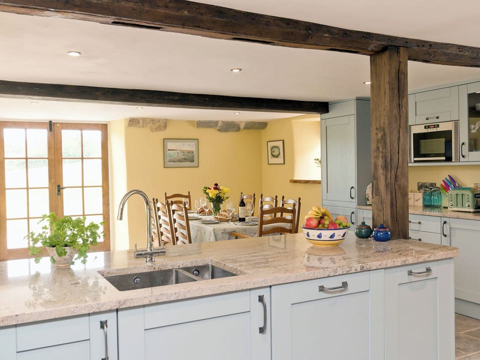 Fantastic kitchen/ diner with beamed ceiling | The Farmhouse at Higher Westwater Farm, Axminster