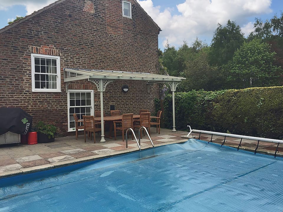Outdoor solar panel heated swimming pool with BBQ and sitting out areas | Greenlands Farmhouse, Barmby Moor, York