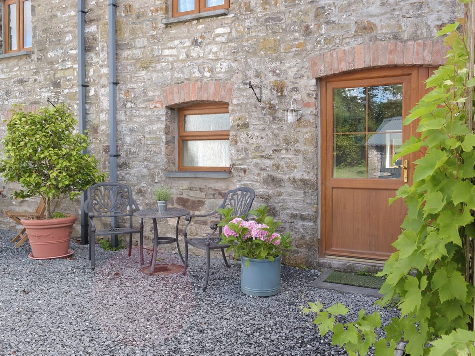 Gravelled patio area | Mill Cottage - Pendegy Mill, Llanybri, near Carmarthen