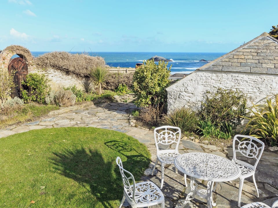 Garden seating area with stunning sea views | Manor House, West Pentire