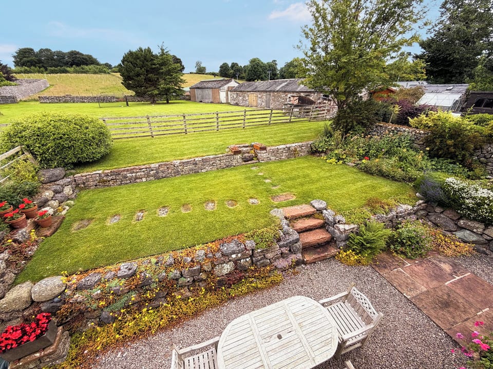 Terraced rear garden with outdoor furniture | Wordsworth Cottage, Sockbridge, near Ullswater