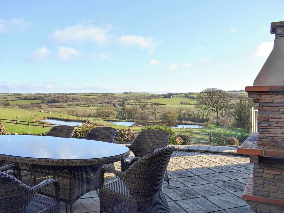 Outstanding views from the Patio area | The Farmhouse - Ffynnonmeredydd Cottages, Mydroilyn, near Aberaeron