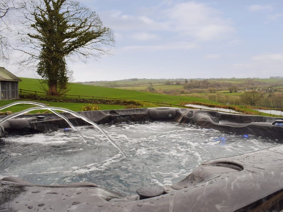 Superb views from the hot tub | The Farmhouse - Ffynnonmeredydd Cottages, Mydroilyn, near Aberaeron