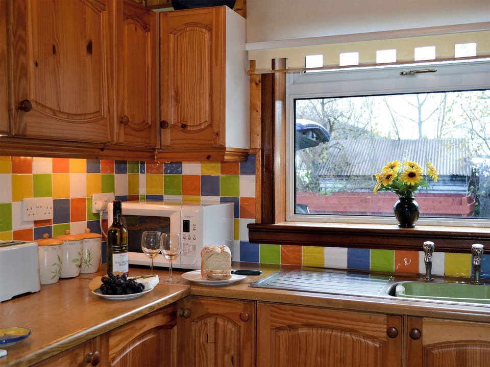 A well equipped kitchen. Coffee pod machine | Riverside Cottage, Drumnadrochit, near Loch Ness
