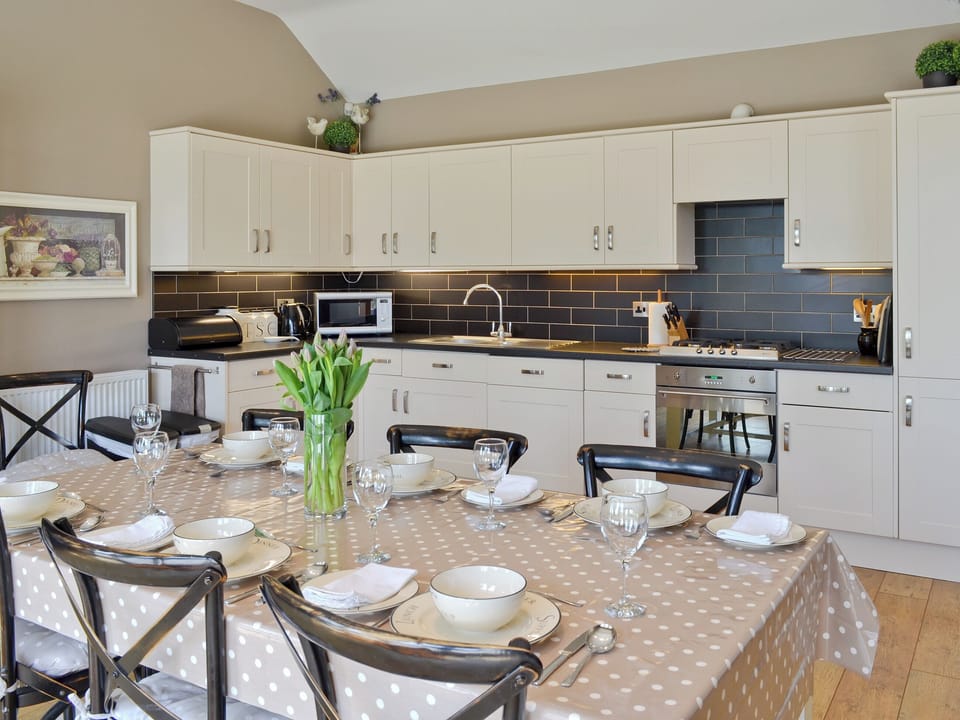Well-appointed fitted kitchen with dining area | The Pavilion, Killerby, near Scarborough
