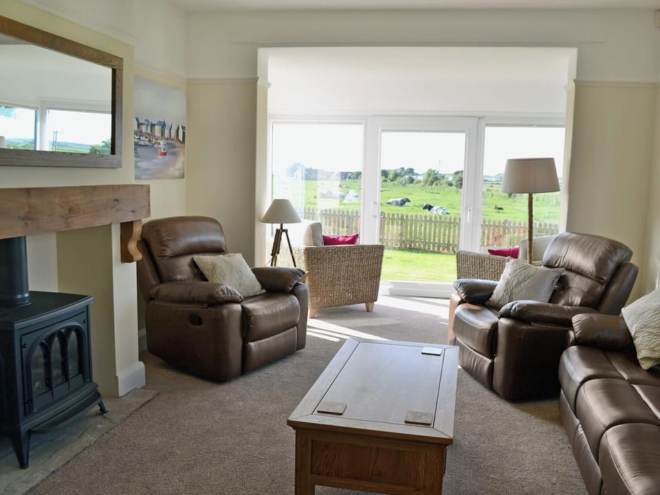 Spacious living room with patio doors | Wayside, Beadnell