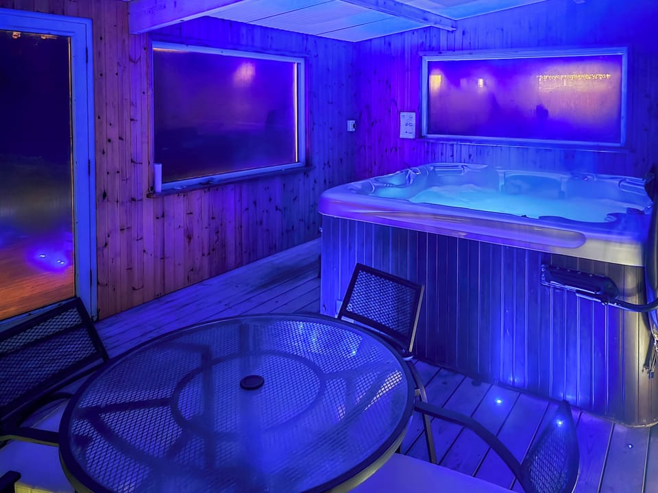 Enjoy a soak in the hot tub | Felin Hedd - Red Kite Holidays, Tregaron, near Aberystwyth