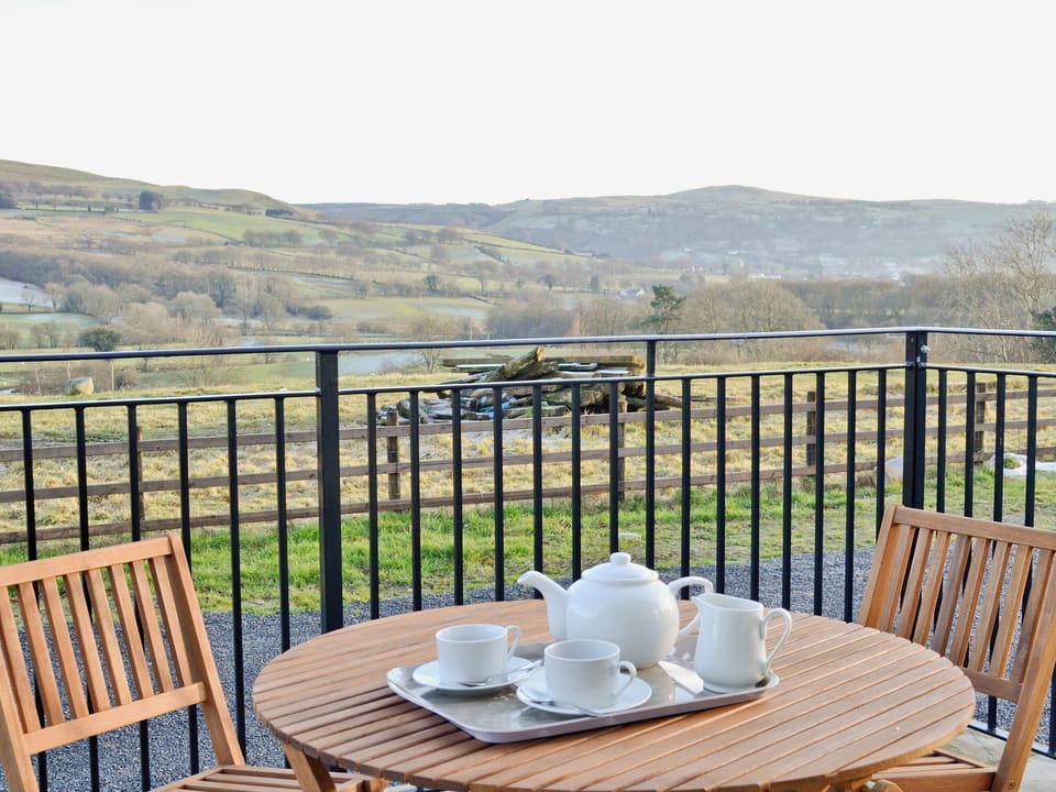 Soak in the views from the sitting out area | Felin Hedd - Red Kite Holidays, Tregaron, near Aberystwyth