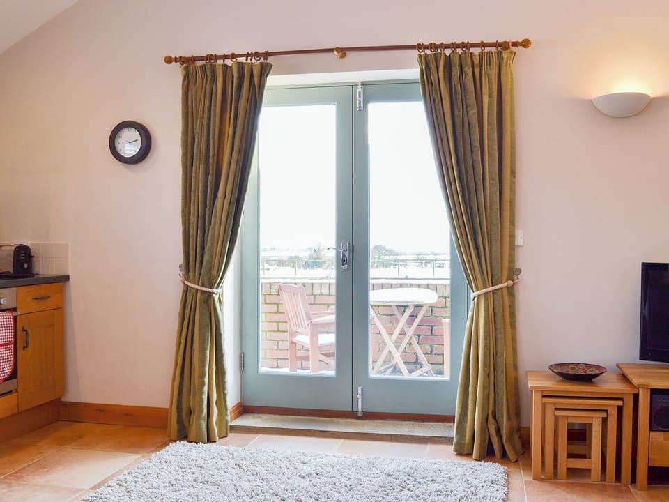 French doors in the living area giving access to the outdoors | The Wests - Grange Farm Cottages, Spaunton, near Lastingham