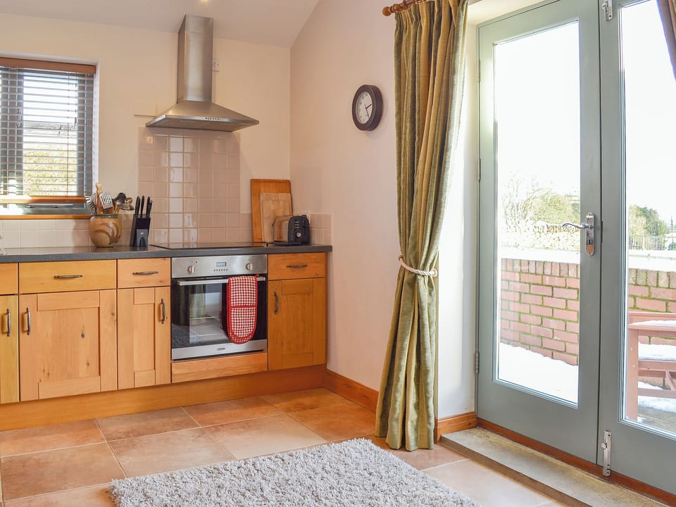Lovely kitchen area and French doors | The Wests - Grange Farm Cottages, Spaunton, near Lastingham