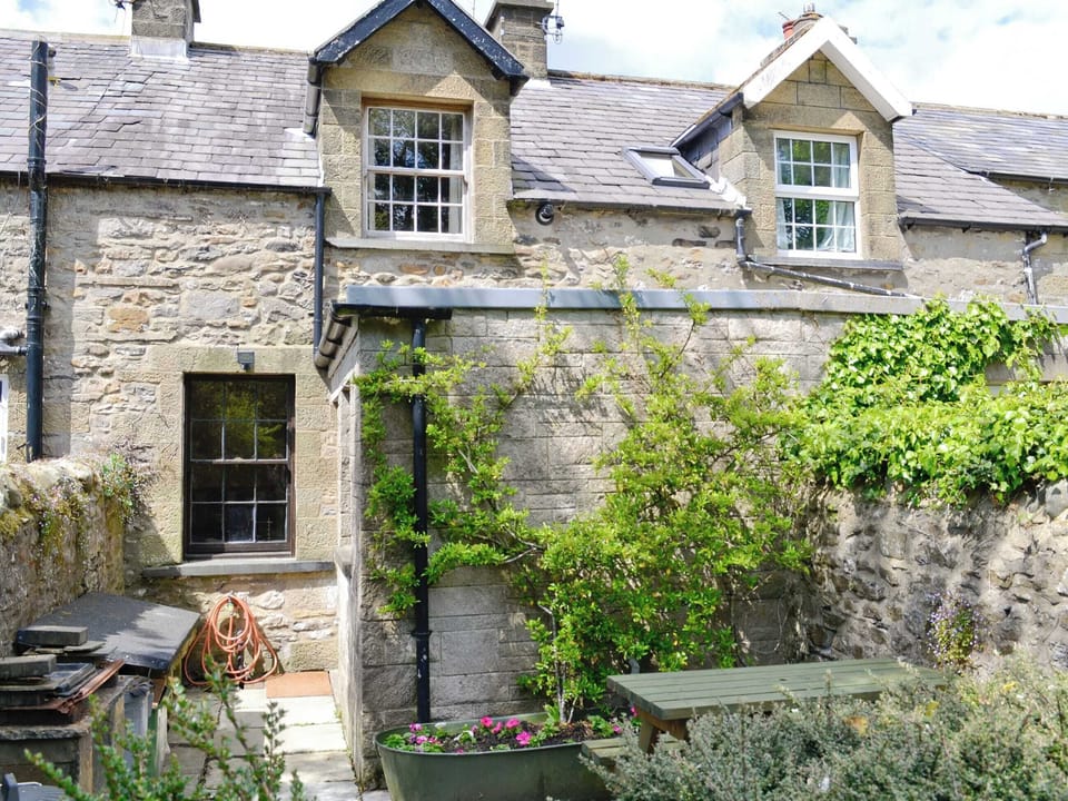 Rear courtyard with sitting out area | Langcliffe Lock Cottage, Langcliffe, near Settle