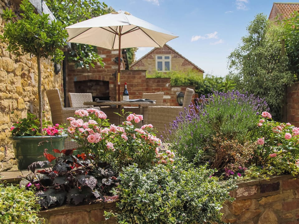 Colourful patio garden | Pond View Cottage, Brantingham, near Beverley