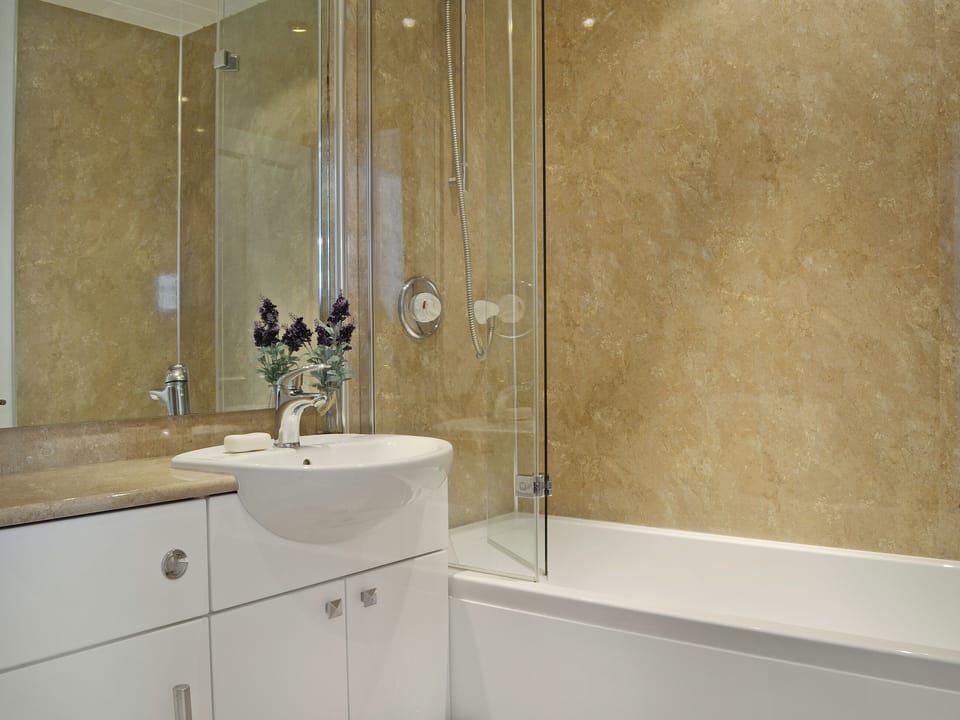 Bathroom with shower over bath | Summerlea Cottage, Moffat