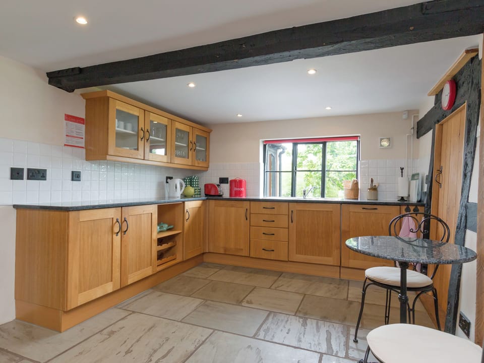Well-equipped fitted kitchen with intimate dining/breakfast area | Parkers - Netherley Hall Cottages, Mathon, near Malvern