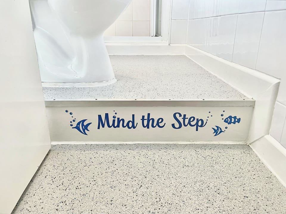 Bathroom - Single step-up to shower, wash-basin and toilet | The Den - Ty Copr, Pen-y-Sarn, near Amlwch