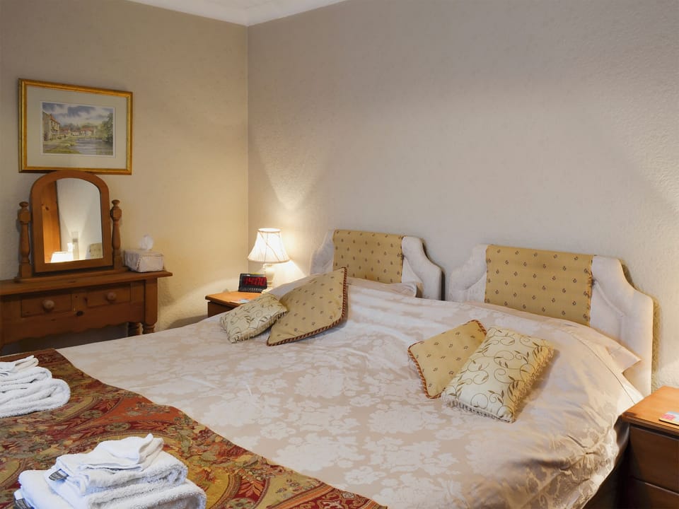 Bedroom with zip and link super kingsize bed | Swallowtail Cottage - Studley House Farm Cottages, Ebberston, near Scarborough