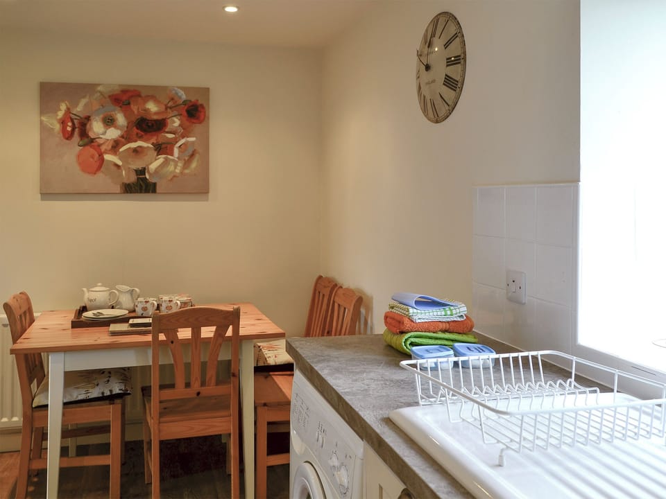 Convenient dining area within kitchen | Foulden Hill Farm Cottage, Foulden