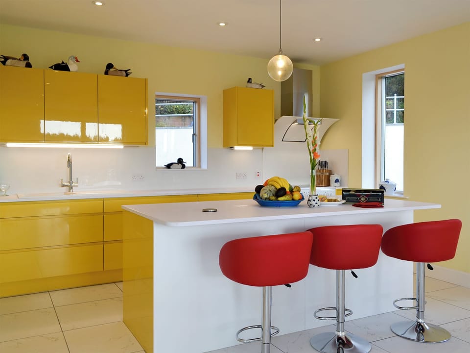 Spacious kitchen area with breakfast bar | Wester Auchleuchrie, Memus, near Kirriemuir