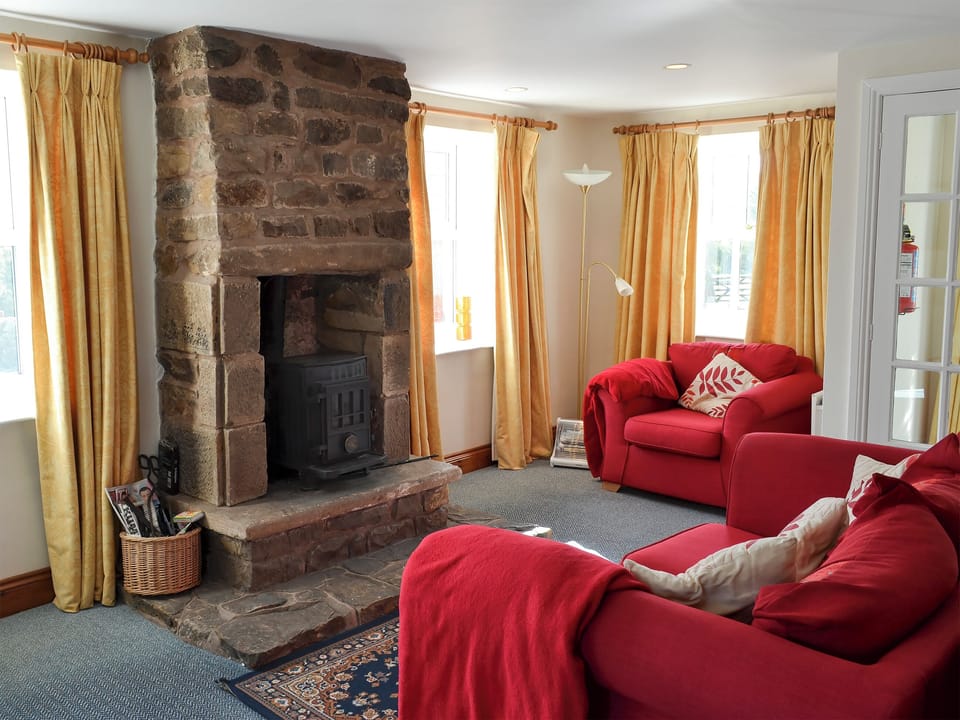 Cosy living area with wood burner | Felbridge Cottage - Gibbs Hill Farm, Once Brewed, Bardon Mill, near Hexham