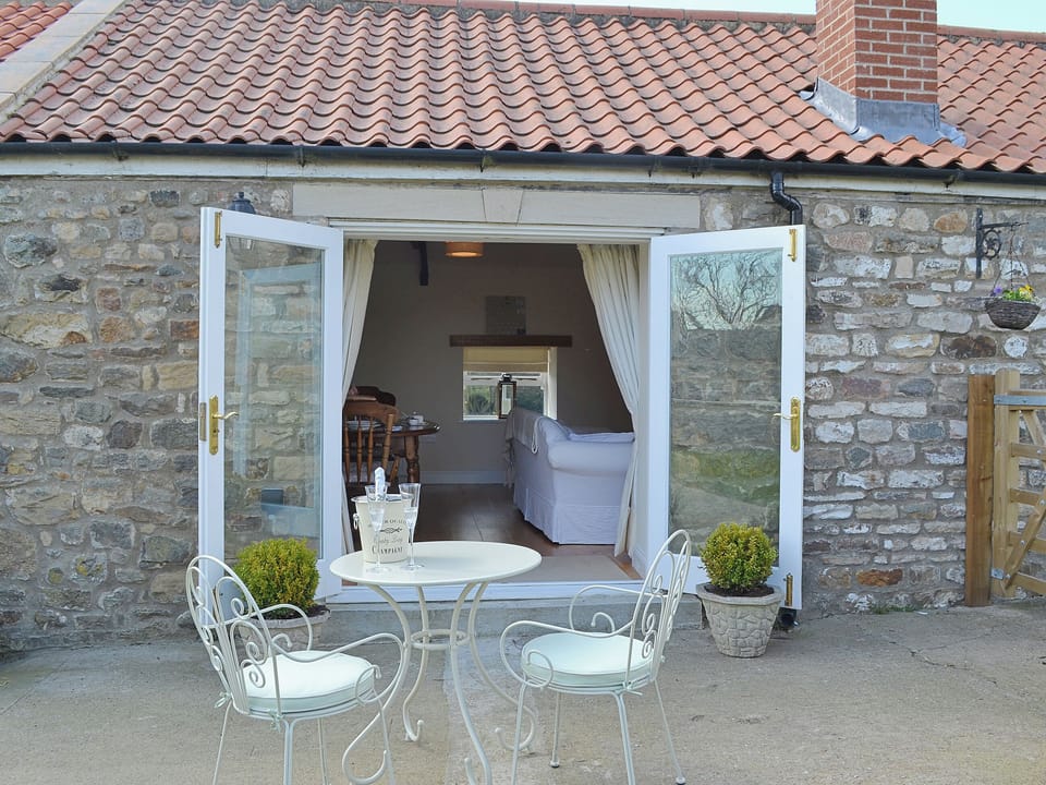 Enjoy a refreshing drink on the pleasant patio | The Stables, Bolam, near Darlington