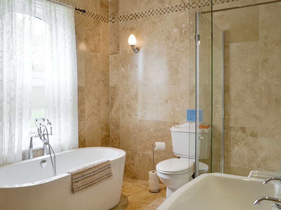 Family bathroom with bath and separate shower cubicle | The Gatehouse - Eldin Hall Cottages, Scarborough