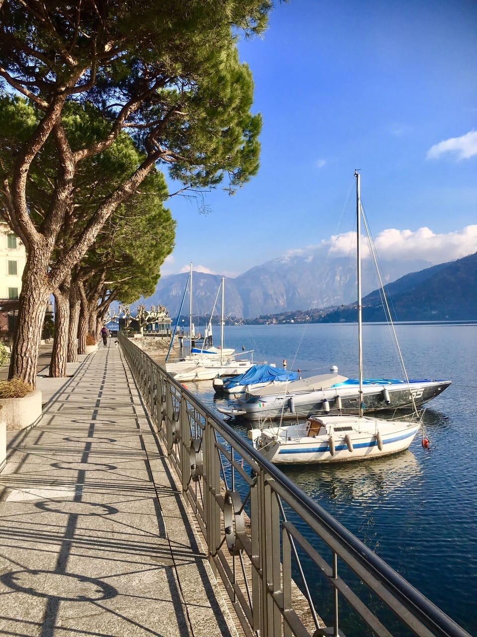 Take a stroll along the pretty promenade here in the village of Lenno.