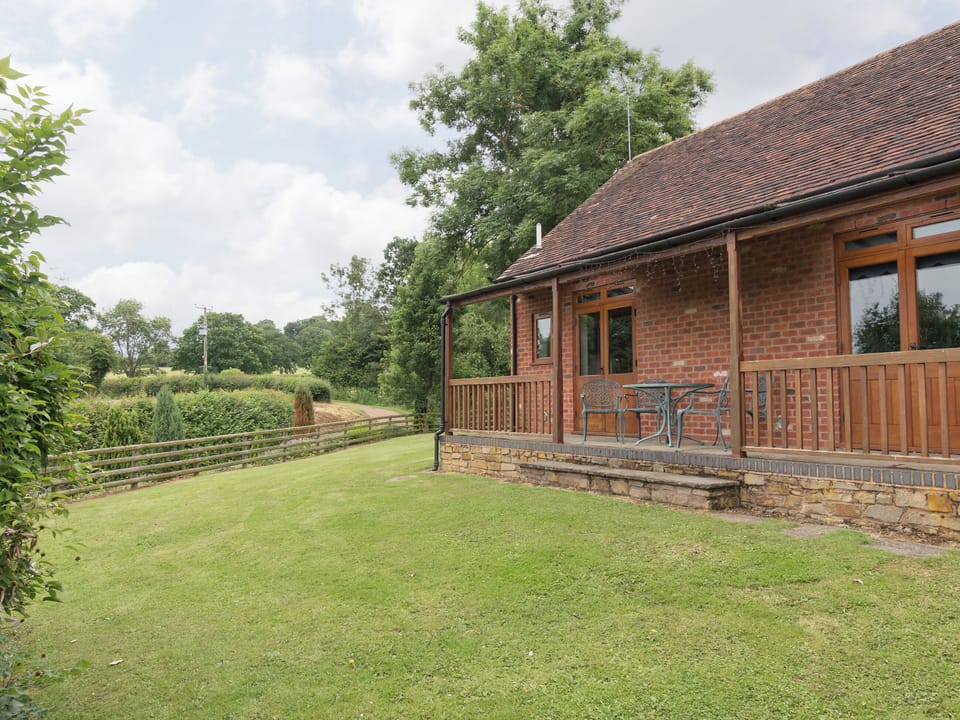 Enclosed lawned garden | Parkers Lodge - Netherley Hall Cottages, Mathon, near Malvern