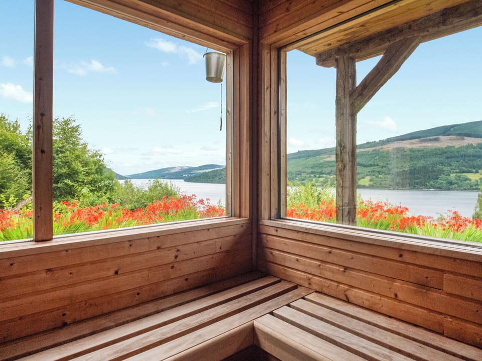 The sauna also has an outside deck to sunbathe whist enjoying the incredible views of the loch and the hills | Chapelburn, Fearnan, near Aberfeldy