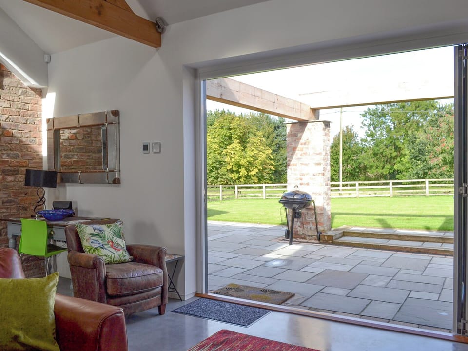 Bi-fold doors from living area to patio | Bluebell Barn, Dunnington, near York