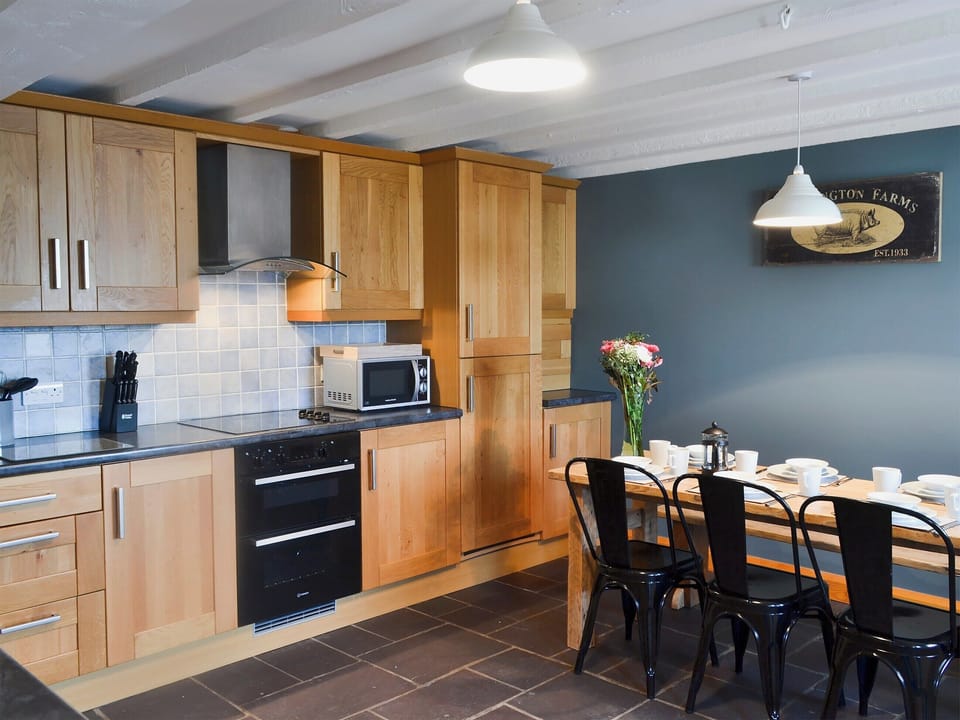 Kitchen and dining area | Yr Hen Stabal - Bronallt Barns, Llanynghenedl, near Holyhead