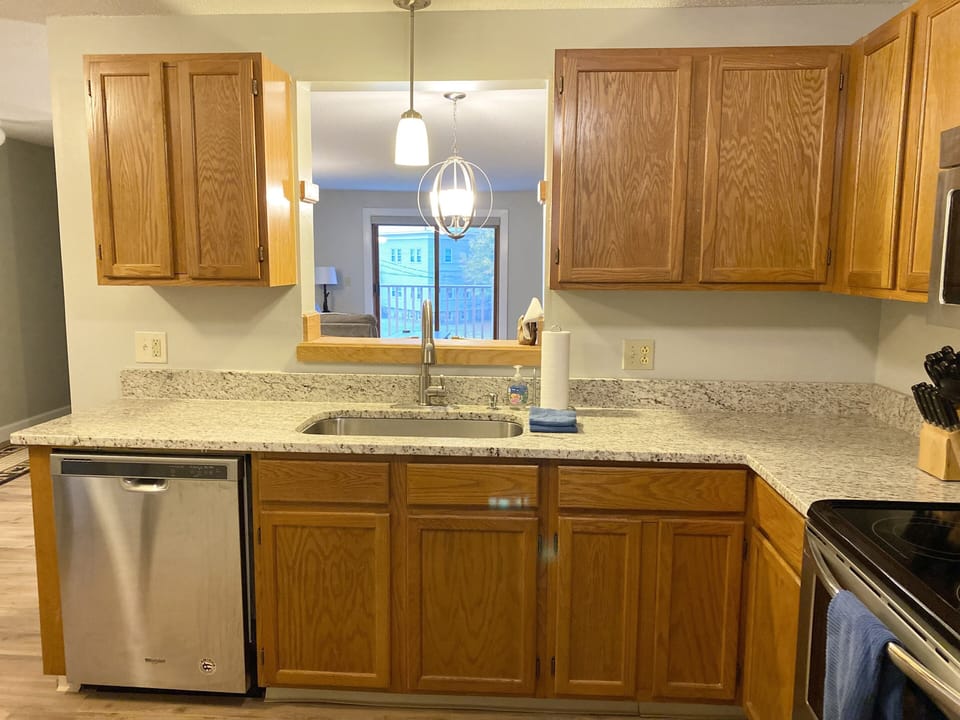 Kitchen opening to living area