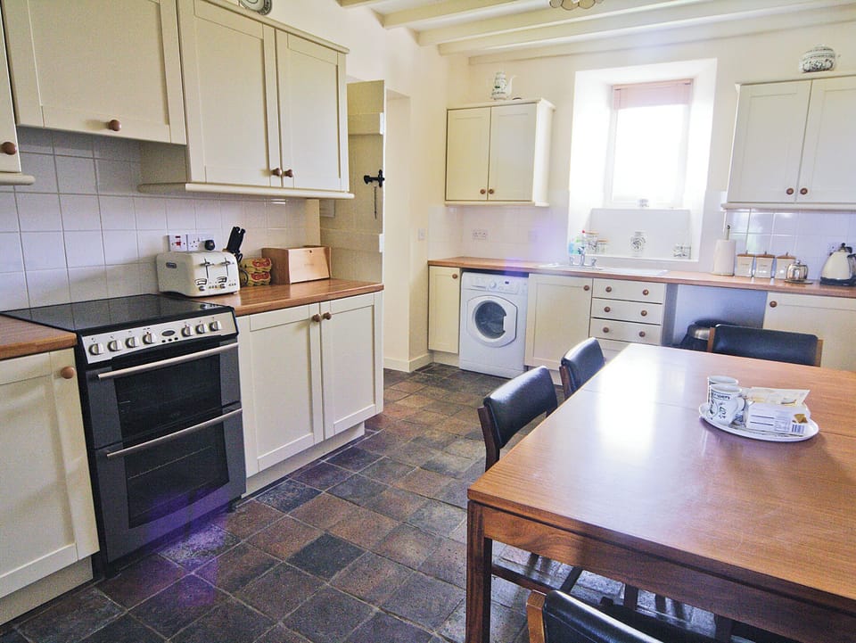 Penrhyn Mawr kitchen with dining area | Penrhyn Mawr, Aberdaron