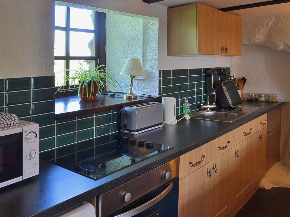 Well equipped fitted kitchen | The Hayloft Barn - Tyddyn Iolyn, near Criccieth