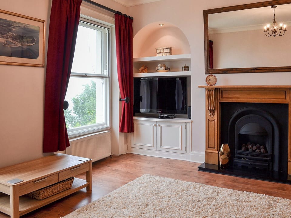 Lovely spacious living room with open fireplace | Oaklands View, Scarborough