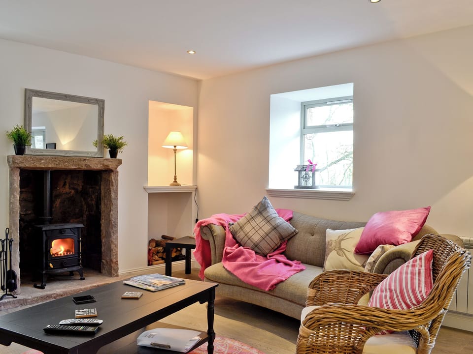 Living room with inglenook fireplace and wood burning stove | St Ronan&rsquo;s Place, Gartocharn, near Drymen