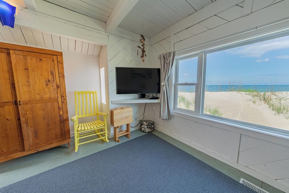 Cozy up in the winter and watch the waves break and your favorite movies.