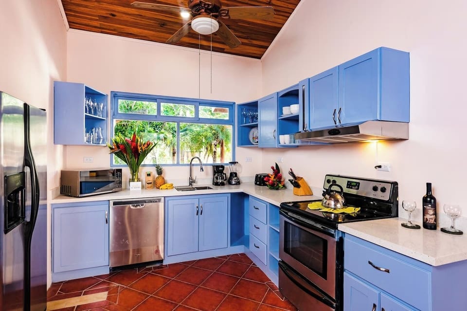 Functional kitchen designed for easy meal prep, perfect for a relaxed beach vacation in Tamarindo.