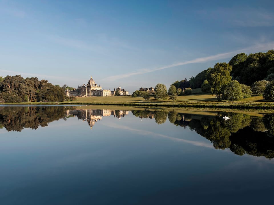 Castle Howard viewed from across one of the ornamental lakes