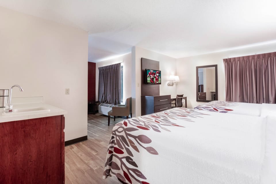 Suite, 2 Queen Beds, Non Smoking | Desk, laptop workspace, blackout drapes, iron/ironing board