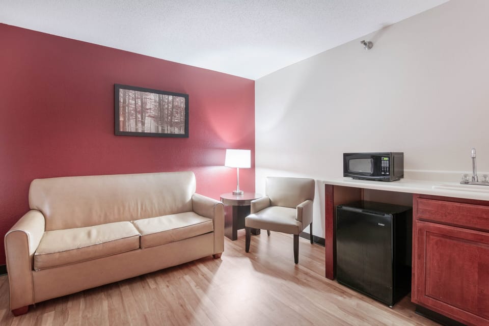 Desk, laptop workspace, blackout drapes, iron/ironing board