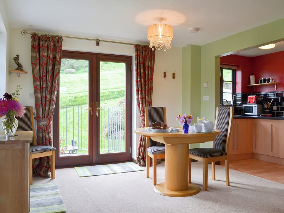Modest dining area next to the patio doors | Tripp Cottage, St Neot, near Liskeard