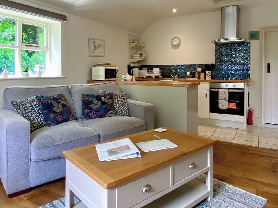 Cosy living area with wood burner | Cherry Laurel - Cherry Garth Cottages, Thornton le Dale near Pickering