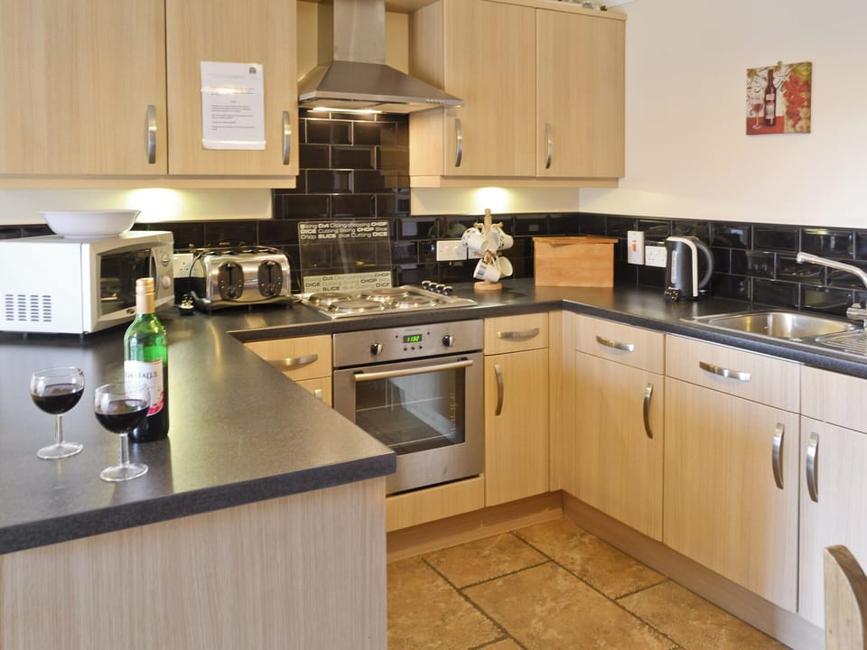Comprehensively-equipped kitchen | Hoggard Cottage - Filey Holiday Cottages, Filey