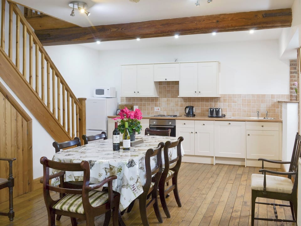 Well-equipped fitted kitchen with convenient dining area | The Granary Barn - Ash Farm Barns, North Willingham, near Market Rasen