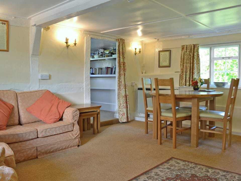 Light and sunny living/dining room with open fire | October Cottage, Aughton, near Marlborough
