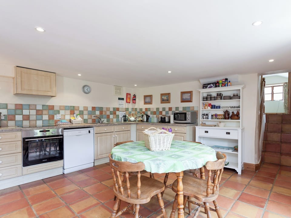 Kitchen with dining table | Old Milking Parlour, Osmington, near Weymouth